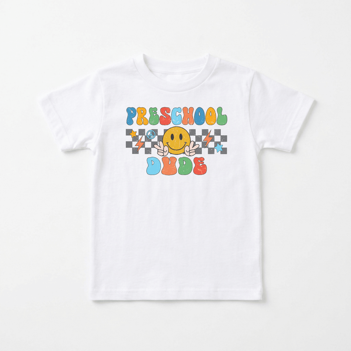 The Toodleroos Preschool Dude Kids Shirt – Back to School Tee features vibrant “PRESCHOOL DUDE” text and a cheerful yellow smiley face flashing peace signs on a black and white checkered background—making this fun retro tee the perfect choice for your preschooler’s standout style.