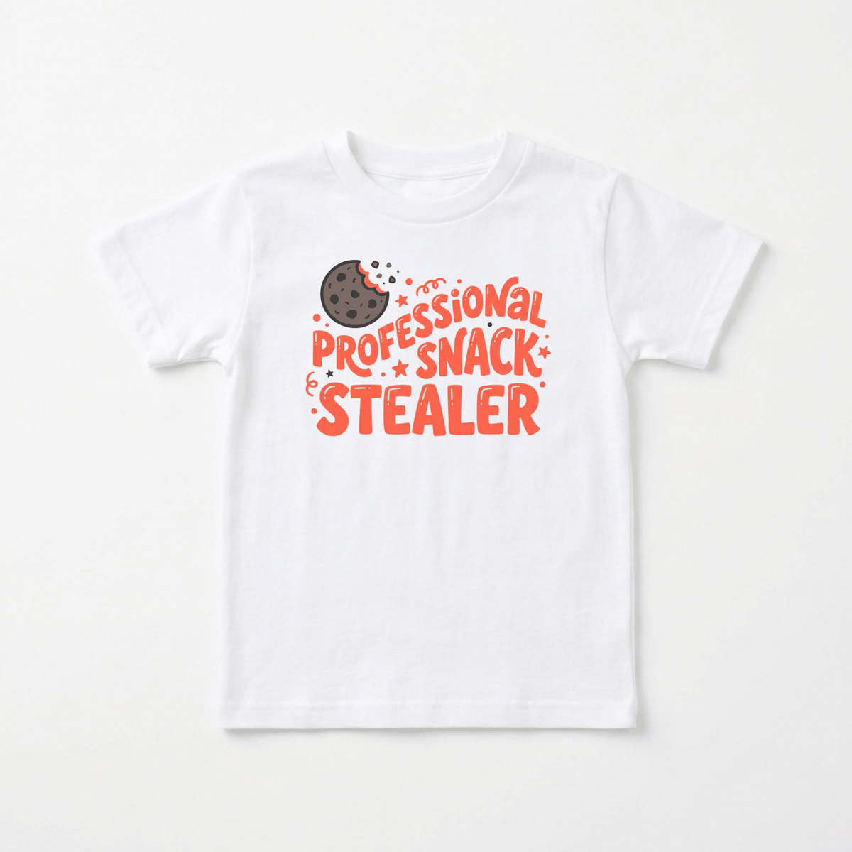 Dress your little mischief-maker in the Toodleroos Professional Snack Stealer Toddler Shirt – a funny cookie tee featuring a playful illustration of a bitten chocolate chip cookie and bold orange and red “Professional Snack Stealer” lettering. This adorable graphic tee is perfect for snack-loving toddlers!.