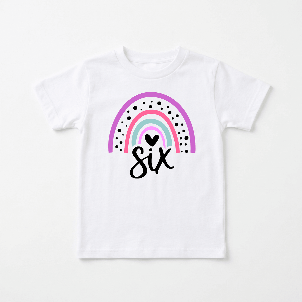 Celebrate your little one’s special day with the Toodleroos Rainbow 6th Birthday Kids Shirt – 6th Birthday Tee, featuring a white t-shirt adorned with a pink, teal, and purple rainbow, black dots, a heart, and the word “six” written in black script beneath the rainbow—a perfect choice for any Rainbow 6th birthday celebration!.
