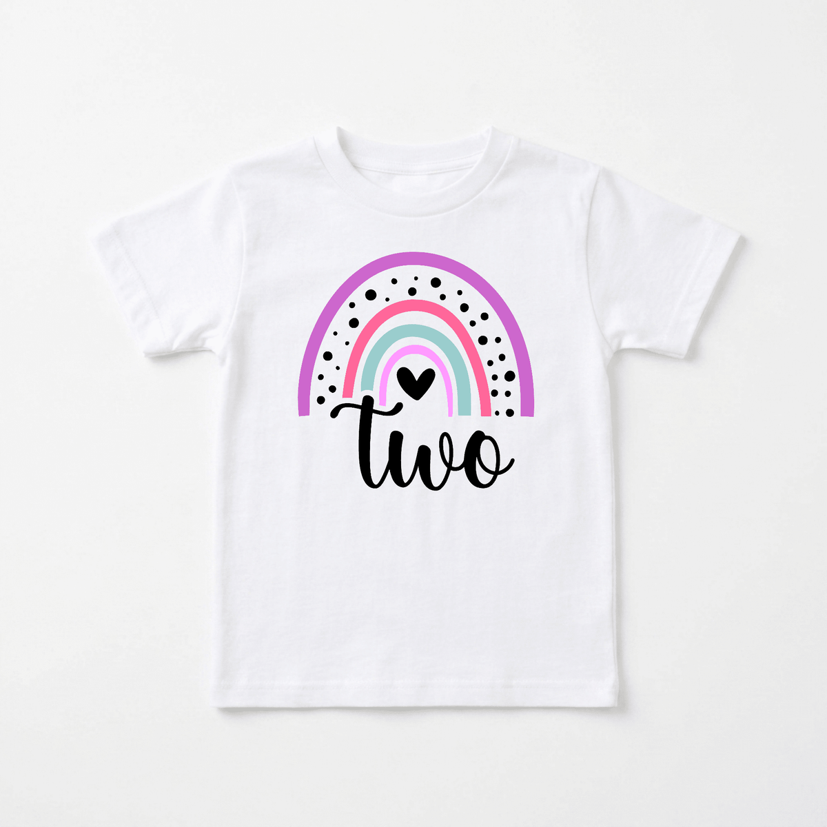 Celebrate your little one’s special day with the Rainbow Two Toddler Shirt – 2nd Birthday Tee by Toodleroos. Featuring a white background with a colorful rainbow, black dots, a small heart, and the word “two” elegantly written in black script beneath the design, this charming shirt is an adorable addition to any collection of personalized kids shirts or 2nd birthday shirts.