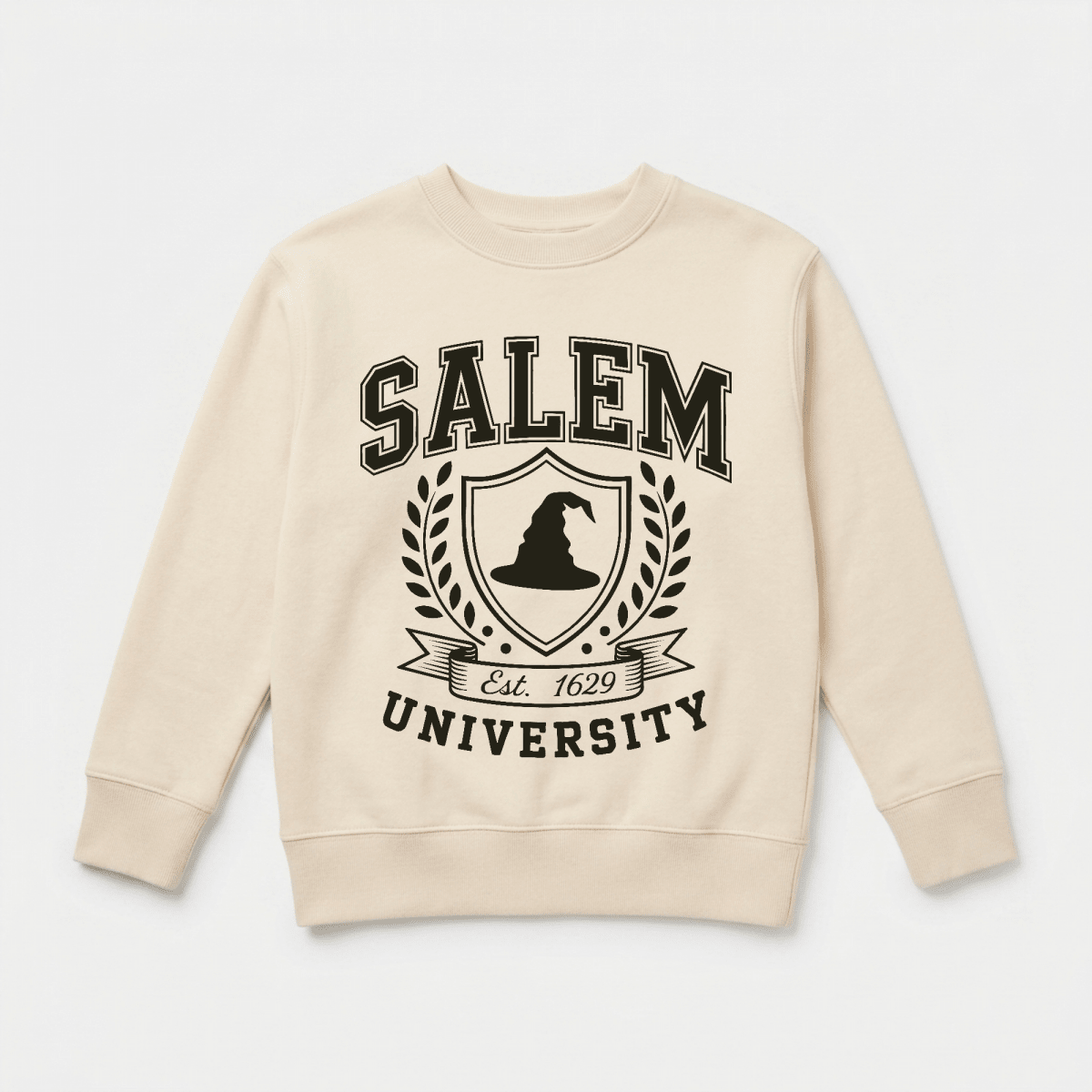 Toodleroos Salem University Toddler Sweatshirt – a beige sweatshirt showcasing “Salem University” in bold black lettering, a witch hat crest with laurel branches, and “Est. 1629” scripted beneath the emblem.