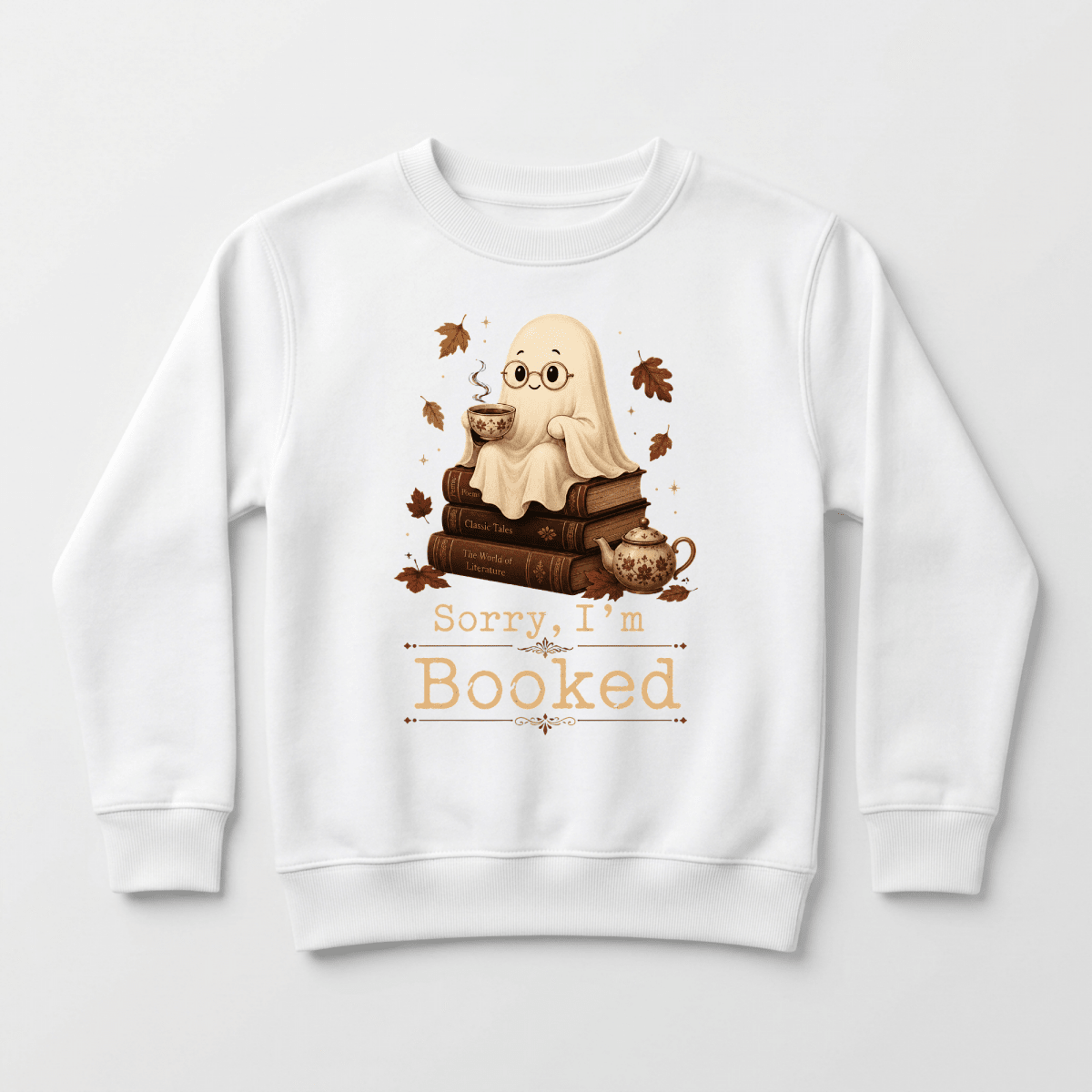 Introducing the Toodleroos “Sorry I’m Booked” Kids Sweatshirt – a cozy white crewneck featuring an adorable ghost with glasses relaxing atop stacked books, holding a mug, with autumn leaves and a teacup nearby. Perfect as a cute fall outfit or Halloween shirt for book-loving kids, this sweatshirt showcases the fun “Sorry, I’m Booked” slogan.