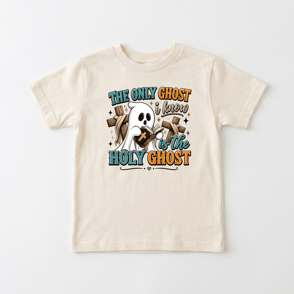 Dress up your little one in the Toodleroos “The Only Ghost I Know Kids Shirt – Holy Ghost Halloween Tee,” a beige t-shirt featuring a cute cartoon ghost holding a Bible. The playful design is accented with colorful fonts that read, “The only ghost I know is the Holy Ghost,” surrounded by stars and hearts. This faith-filled kids’ shirt offers a unique and fun way for children to celebrate Halloween with Christian inspiration.