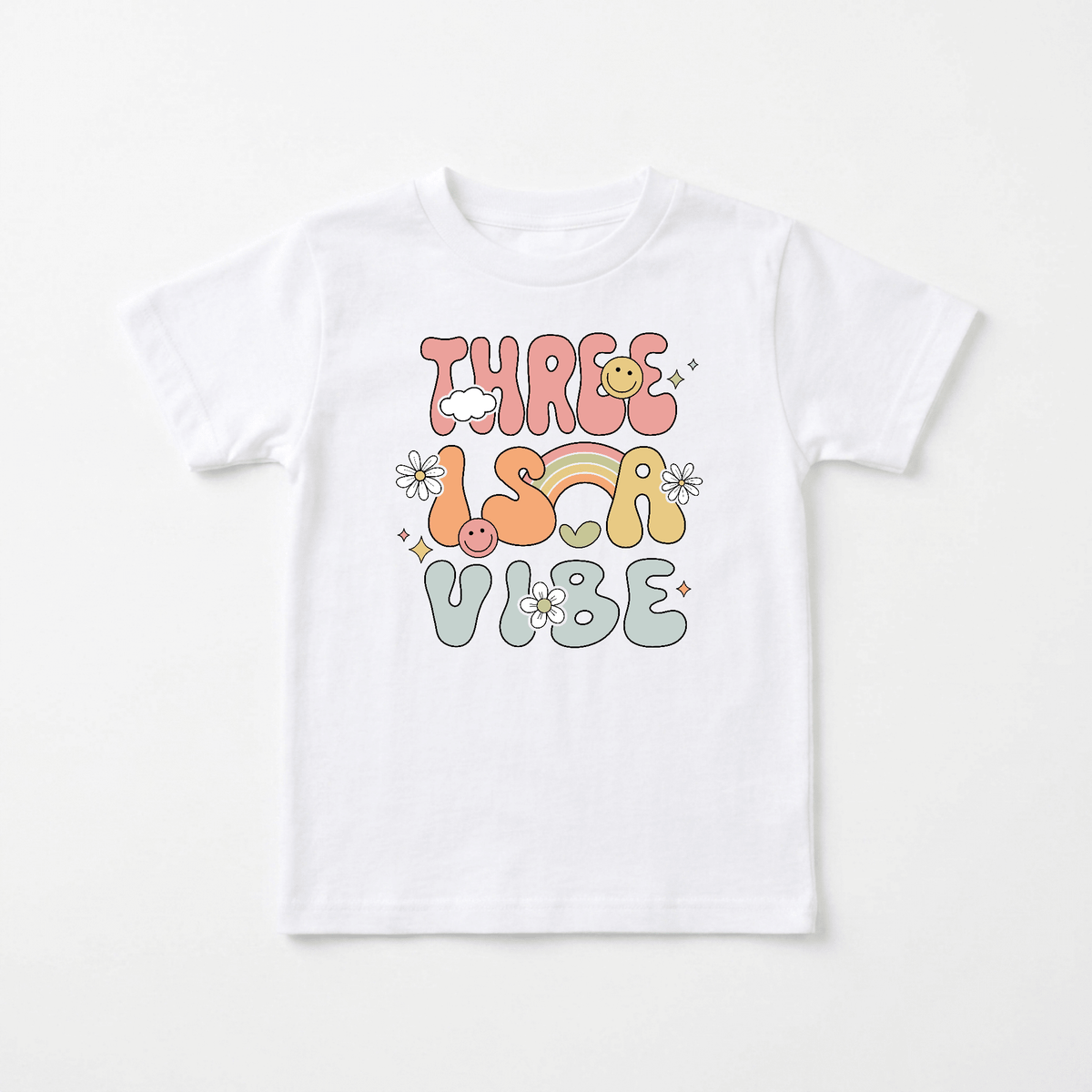 Celebrate your child’s special day with the Toodleroos Three Is a Vibe Toddler Shirt – Retro 3rd Birthday Tee. This white t-shirt features playful, colorful text that says “Three Is a Vibe,” accented by cheerful rainbow, smiley face, and flower designs in vibrant red, orange, yellow, and blue shades. Perfect for little ones turning three, this adorable shirt is a fun choice for 3rd birthday celebrations or as a standout piece in any retro kids’ wardrobe.