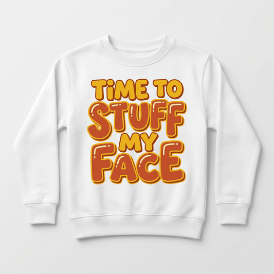 Dress your little one in the Toodleroos Time to Stuff My Face Thanksgiving Toddler Sweatshirt – a cozy white pullover featuring bold, playful orange and yellow text that reads “TIME TO STUFF MY FACE” centered on the front. This funny Turkey Day sweatshirt is perfect for kids to wear during Thanksgiving celebrations or as a cheerful holiday favorite.