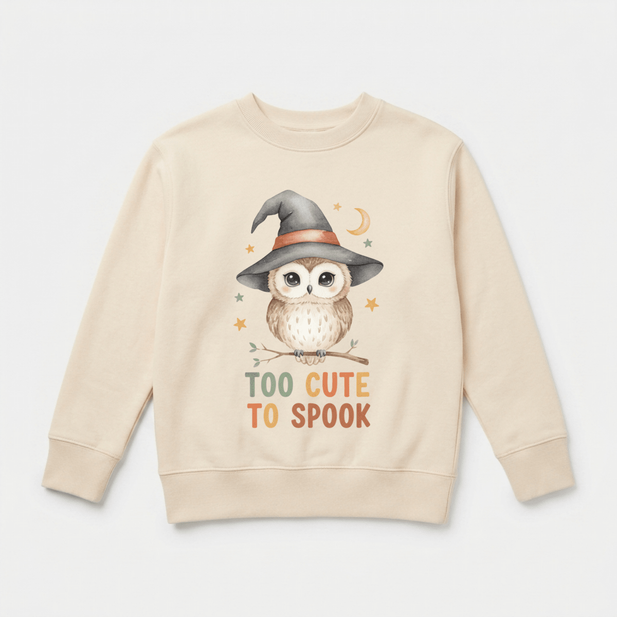 The Toodleroos Toddler Halloween Sweatshirt – Too Cute to Spook Owl Pullover features a beige design with a cartoon owl in a witch hat, perched on a branch surrounded by stars and a crescent moon. “TOO CUTE TO SPOOK” is printed in orange letters beneath the owl, making it the perfect cute Halloween outfit for toddlers.