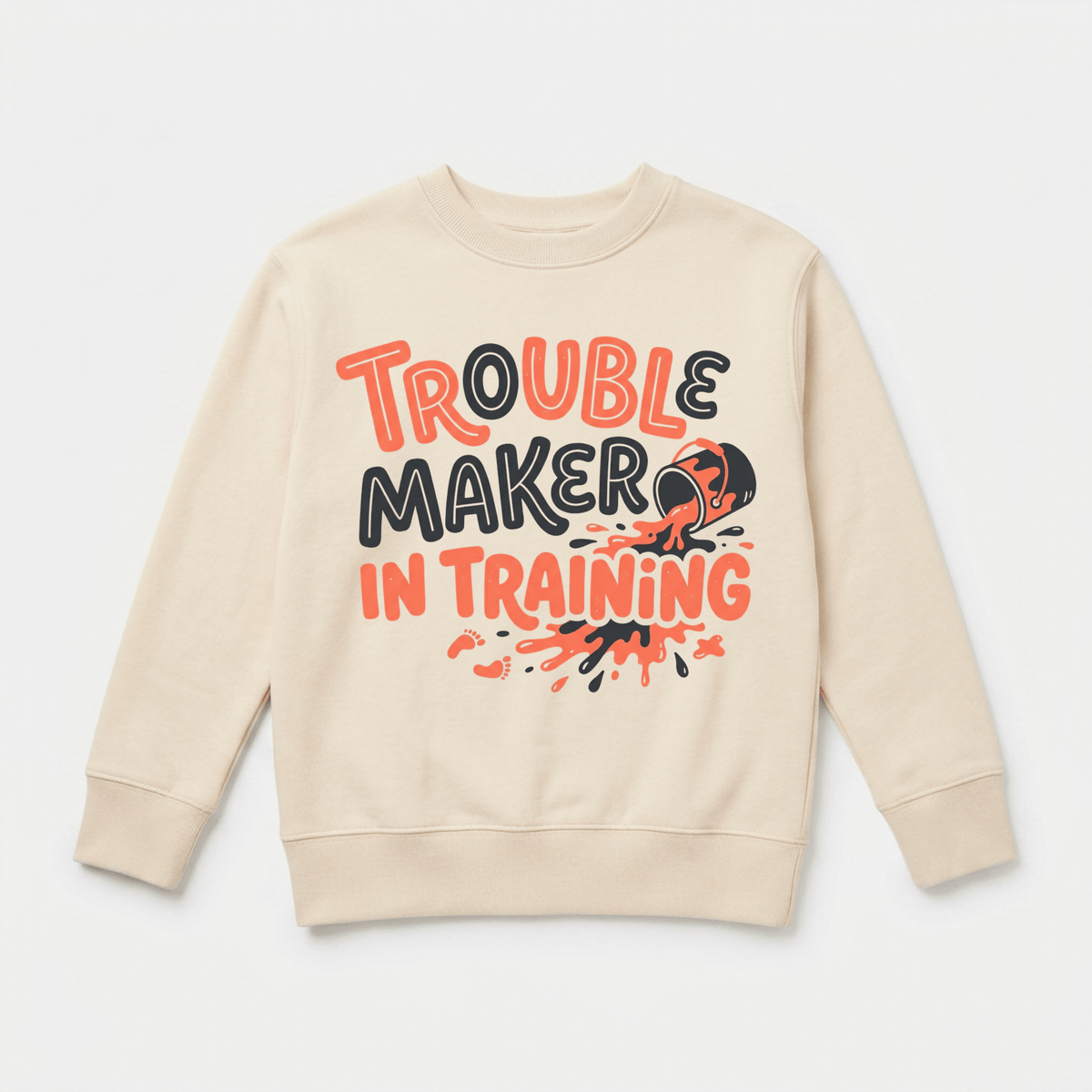 The Toodleroos Trouble Maker in Training Toddler Sweatshirt – Funny Toddler Pullover features bold black and orange lettering with the playful phrase “Trouble Maker in Training” and an illustration of a broken orange ball splattering beneath the text. Made from cozy fleece, this beige sweatshirt is the perfect gift for spirited toddlers who love to stand out.