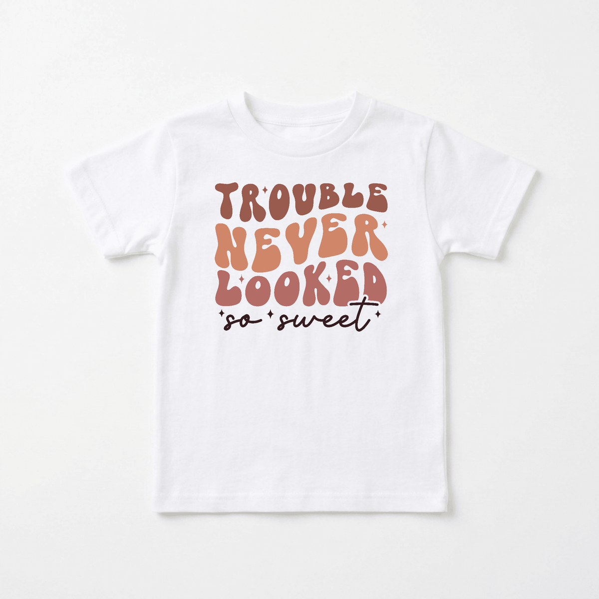 The Toodleroos “Trouble Never Looked So Sweet Kids Shirt – Funny Retro Tee” features bold, retro-style lettering in brown and orange on the front, making it a playful and humorous addition to any retro kids shirt collection.