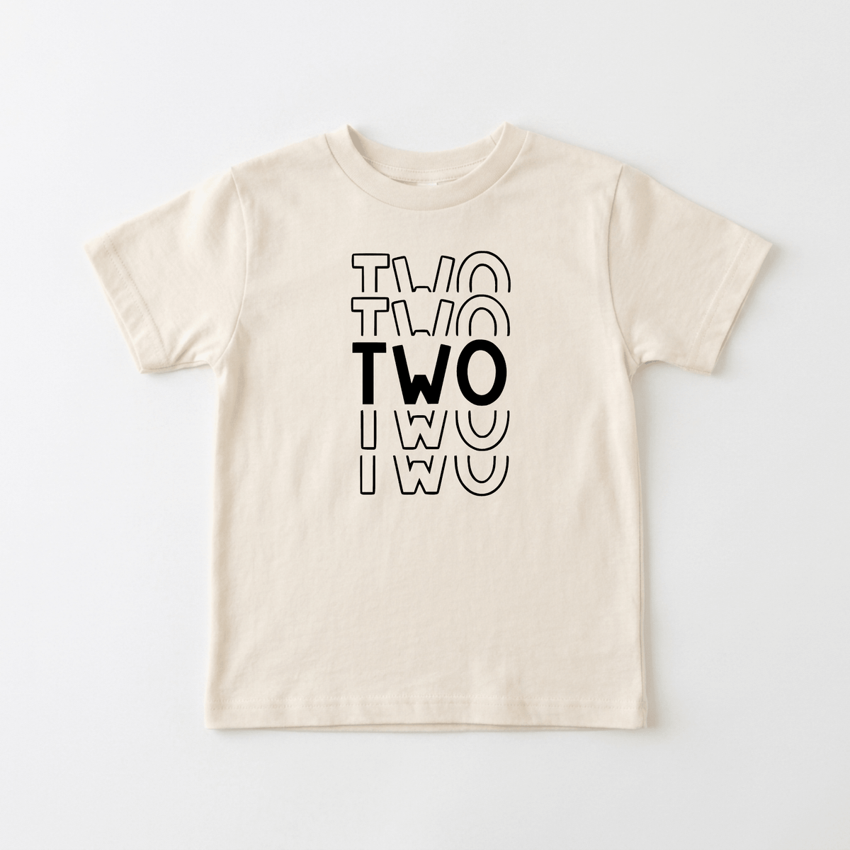 Celebrate your little one’s big day with the Toodleroos Two Birthday Toddler Shirt – 2nd Birthday Tee! Featuring a beige, gender-neutral design, this birthday shirt showcases the word “TWO” printed three times in black, overlapping vertically—the middle “TWO” is bold and solid while the top and bottom versions are outlined. It’s an adorable choice for 2nd birthday shirts!.