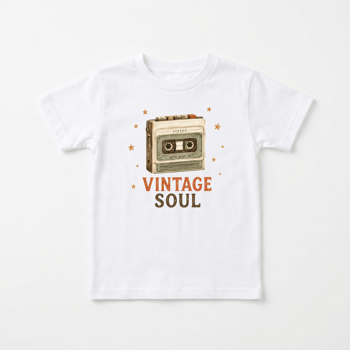 Dress your little one in the Toddler Music Shirt – Vintage Soul Retro Cassette Short-Sleeve Tee from Toodleroos, featuring a playful cassette tape design surrounded by tiny stars and “VINTAGE SOUL” boldly displayed in orange and brown—perfect for kids who want to rock a cool retro cassette style with vintage flair.