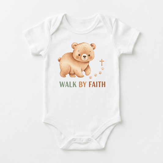The Toodleroos Walk by Faith Baby Onesie – Christian Bear Design features a charming brown bear, paw prints, a cross, and the words WALK BY FAITH in green and brown lettering on the front. This adorable Christian onesie is ideal for baptisms or offering everyday inspiration to your little one.