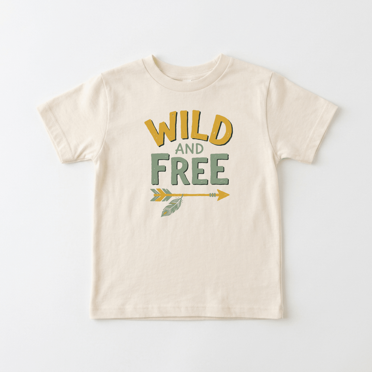Introducing the Toodleroos Wild and Free Boho Toddler Shirt – Feathered Arrow Tee: a cream-colored, nature-inspired unisex kids shirt featuring “WILD AND FREE” in vibrant yellow and green lettering above a matching green and yellow feathered arrow, all displayed on a plain white background. Perfect for little adventurers who love the outdoors!.
