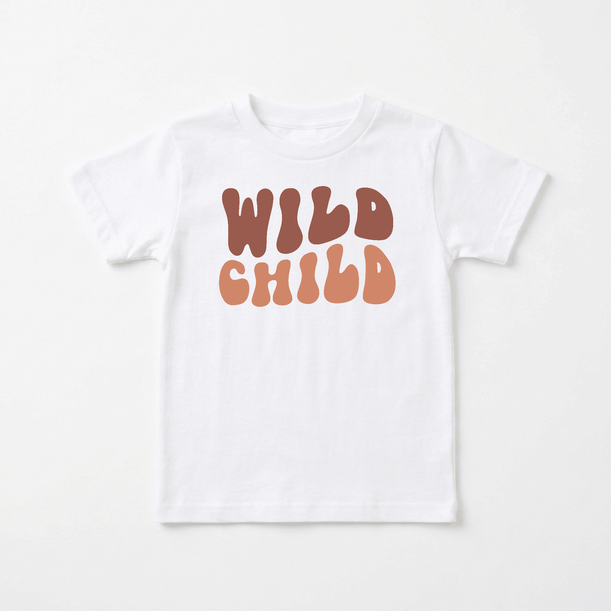 The Toodleroos Wild Child Kids Shirt – Boho Retro Tee features large, bold, wavy brown and orange “WILD CHILD” lettering on the front of a classic white t-shirt—an ideal retro-inspired choice for free-spirited little ones.