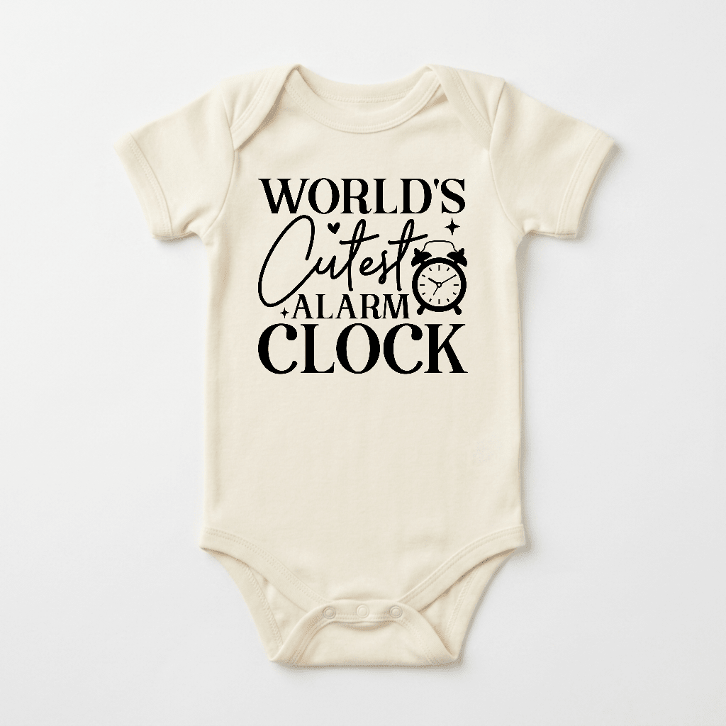 Dress your little one in the Toodleroos “World’s Cutest Alarm Clock” Onesie – a cream-colored, unisex baby bodysuit featuring playful black text that reads “World’s Cutest Alarm Clock” and a charming alarm clock illustration beside the word “Cutest.” This funny baby bodysuit makes an ideal baby shower gift for new parents.