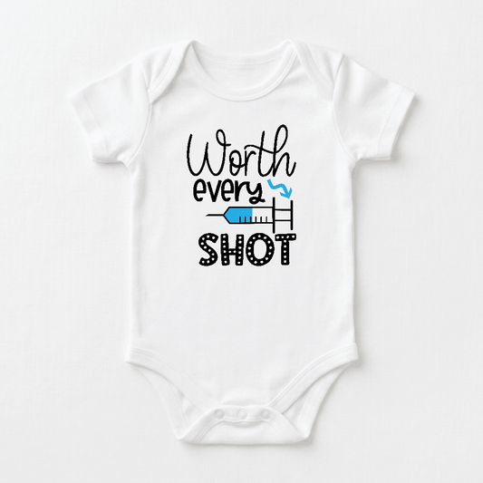 Introducing the Toodleroos “Worth Every Shot Baby Onesie – IVF Journey Bodysuit”: a white infant bodysuit featuring the heartfelt phrase “Worth every shot” in stylish black and blue lettering, accented with a charming blue syringe graphic beneath the word “every.” This adorable onesie is a meaningful gift for those celebrating their fertility journey and makes a perfect baby announcement outfit.